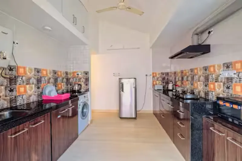 Fitted kitchen with washing machine in the beach apartment