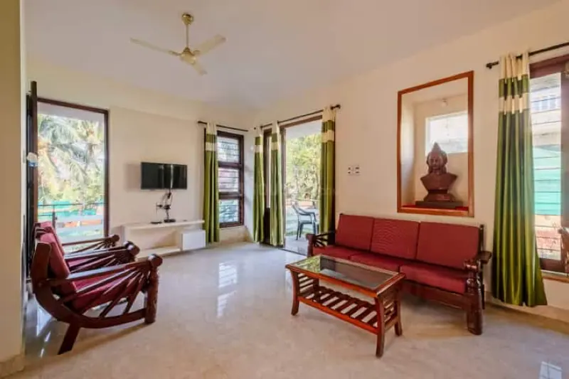 Bright living room with sofa and TV