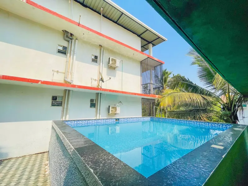 Pool with the Celeste Stay building behind it