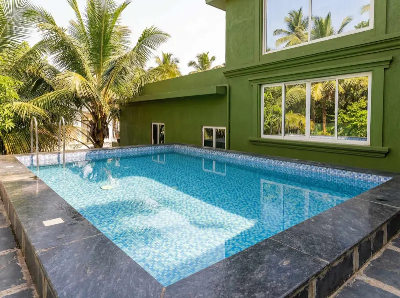 Pool on a sunny day with coconut palms