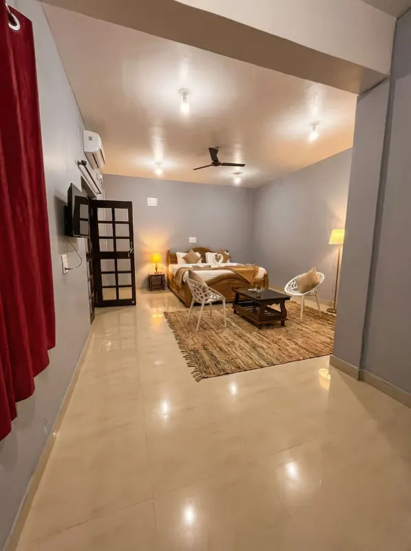 Studio with rug, coffee table and seating